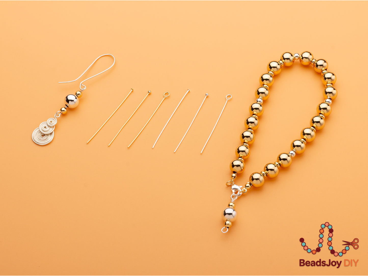 Handmade wire-wrapped spiral earring and gold bead bracelet with lobster clasp displayed alongside gold and silver head pins and eye pins – BeadsJoy DIY jewelry making kit**
