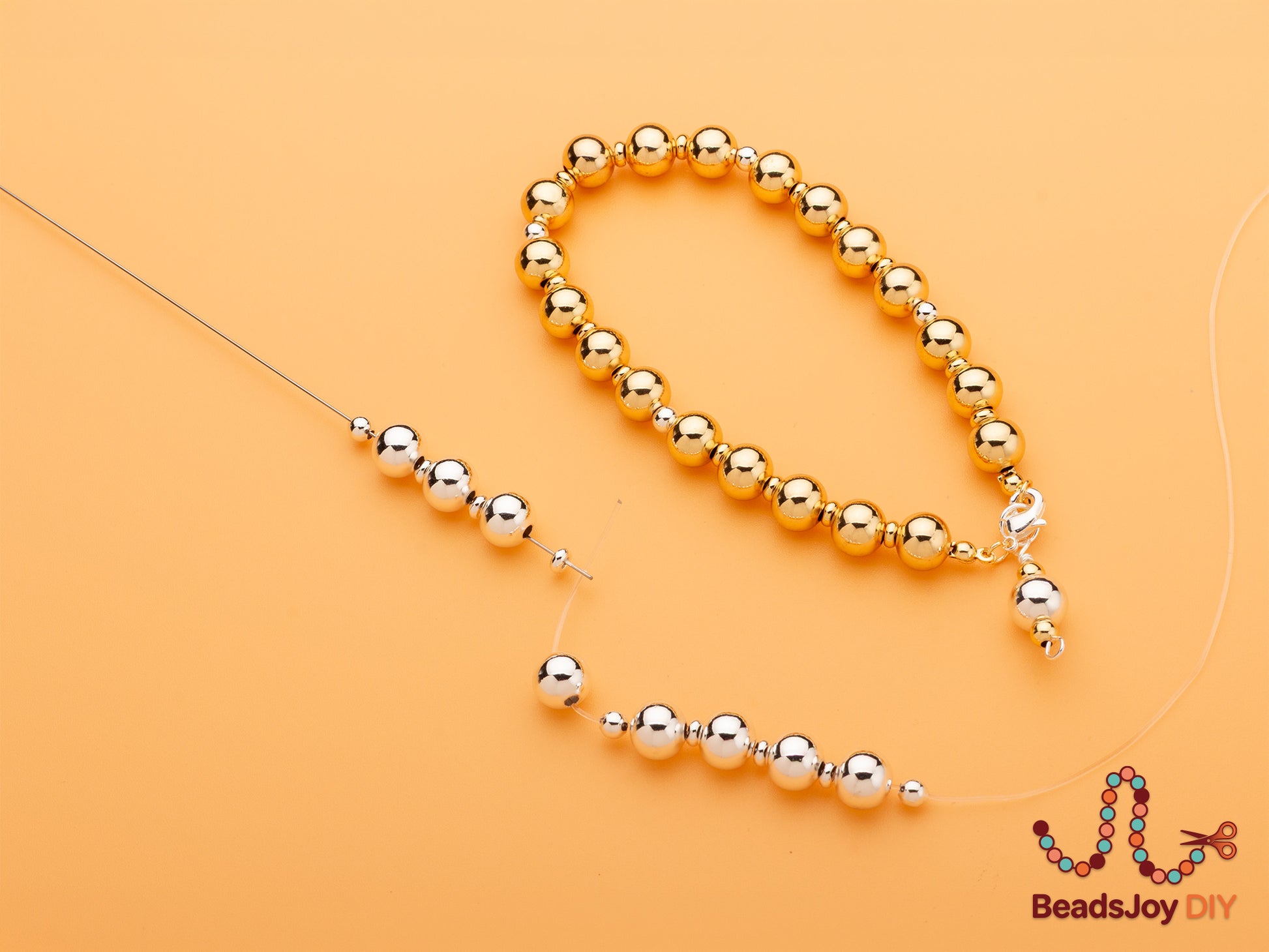 Completed gold bead bracelet and silver bead strand in progress on beading wire, showing DIY jewelry making process – BeadsJoy DIY