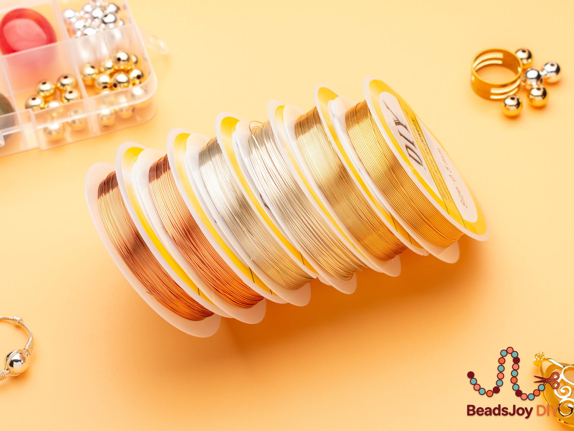 Gold, silver and rose gold colour-retaining copper wire spools stacked together for DIY jewelry making, BeadsJoy DIY